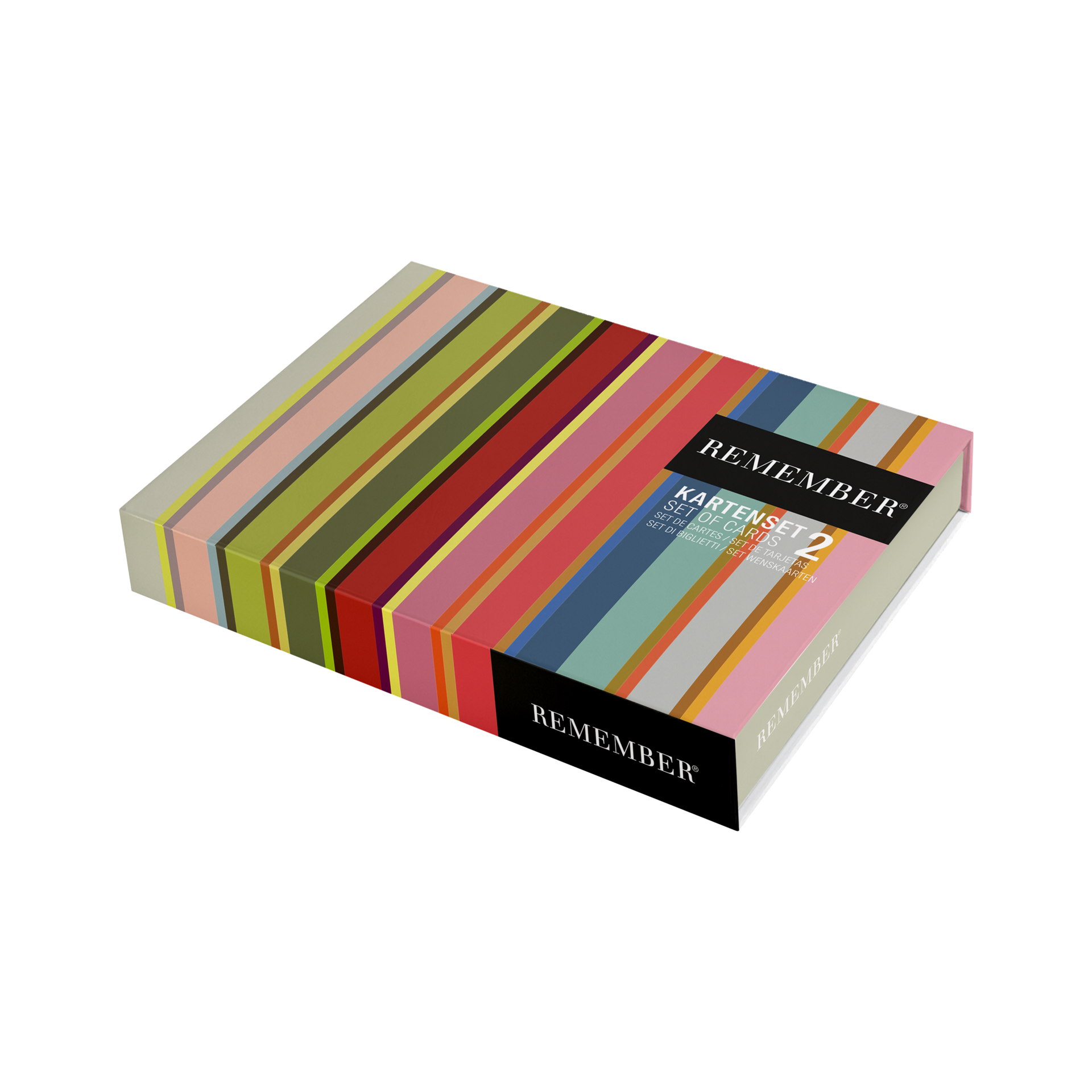 Boîte du jeu de cartes « REMEMBER 2 » : étui magnétique rayé multicolore (rose, vert, rouge, jaune, bleu, gris), vu de dessus en biais. Étiquette noire « REMEMBER, jeu de cartes n° 2 ».