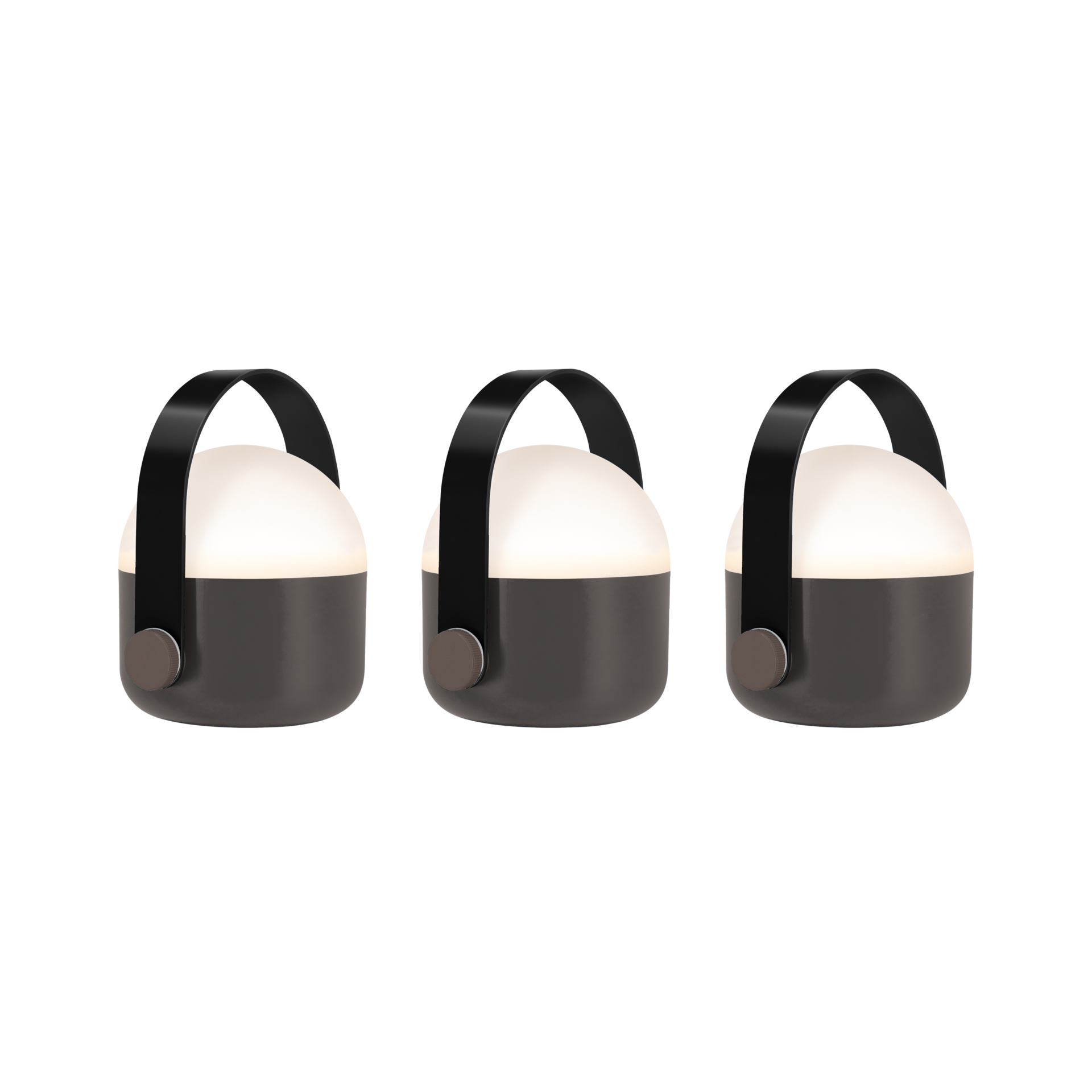 Drei kompakte, akkubetriebene OLE mini LED-Leuchten in Schwarz, seitlich aufgereiht. Jede hat eine matte dunkelgraue zylindrische Basis, warmweiß leuchtenden oberen Teil und schwarzen Tragegriff mit braunen Knöpfen.