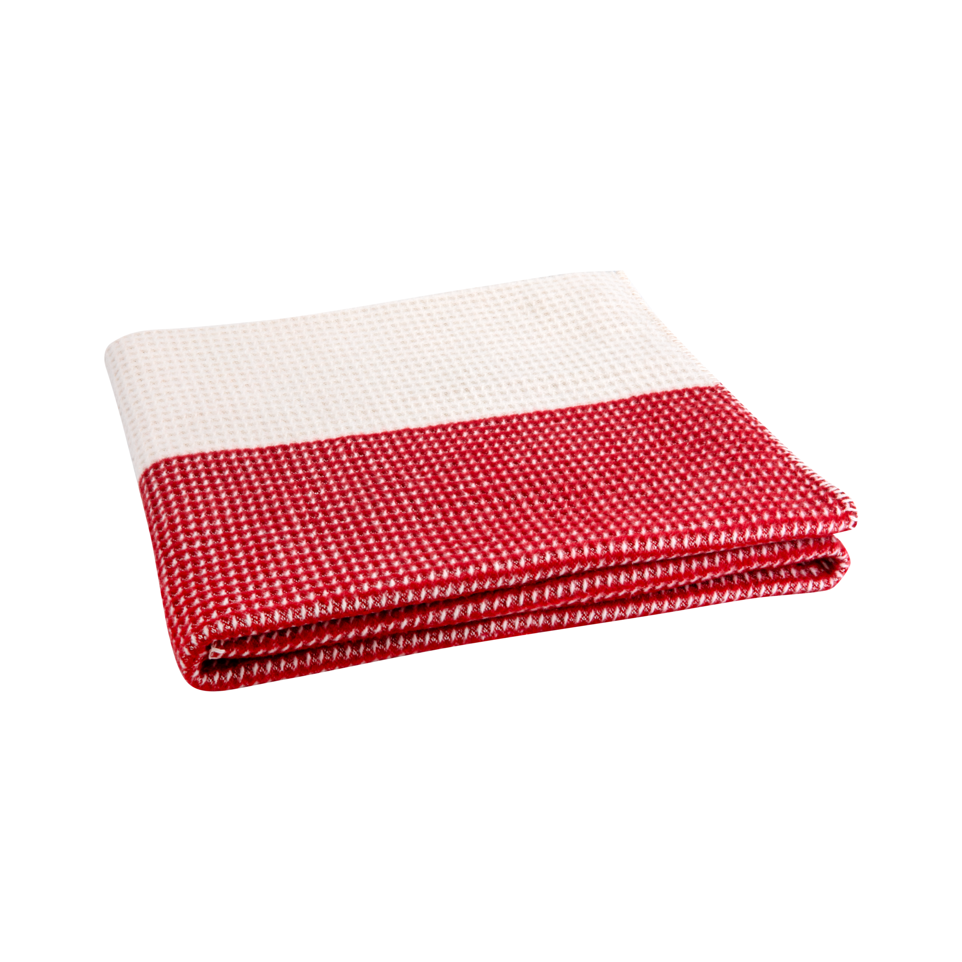 Gefaltete, zweifarbige Decke 'Malie' mit Waffelmuster. Die obere Hälfte ist weiß, die untere rot.