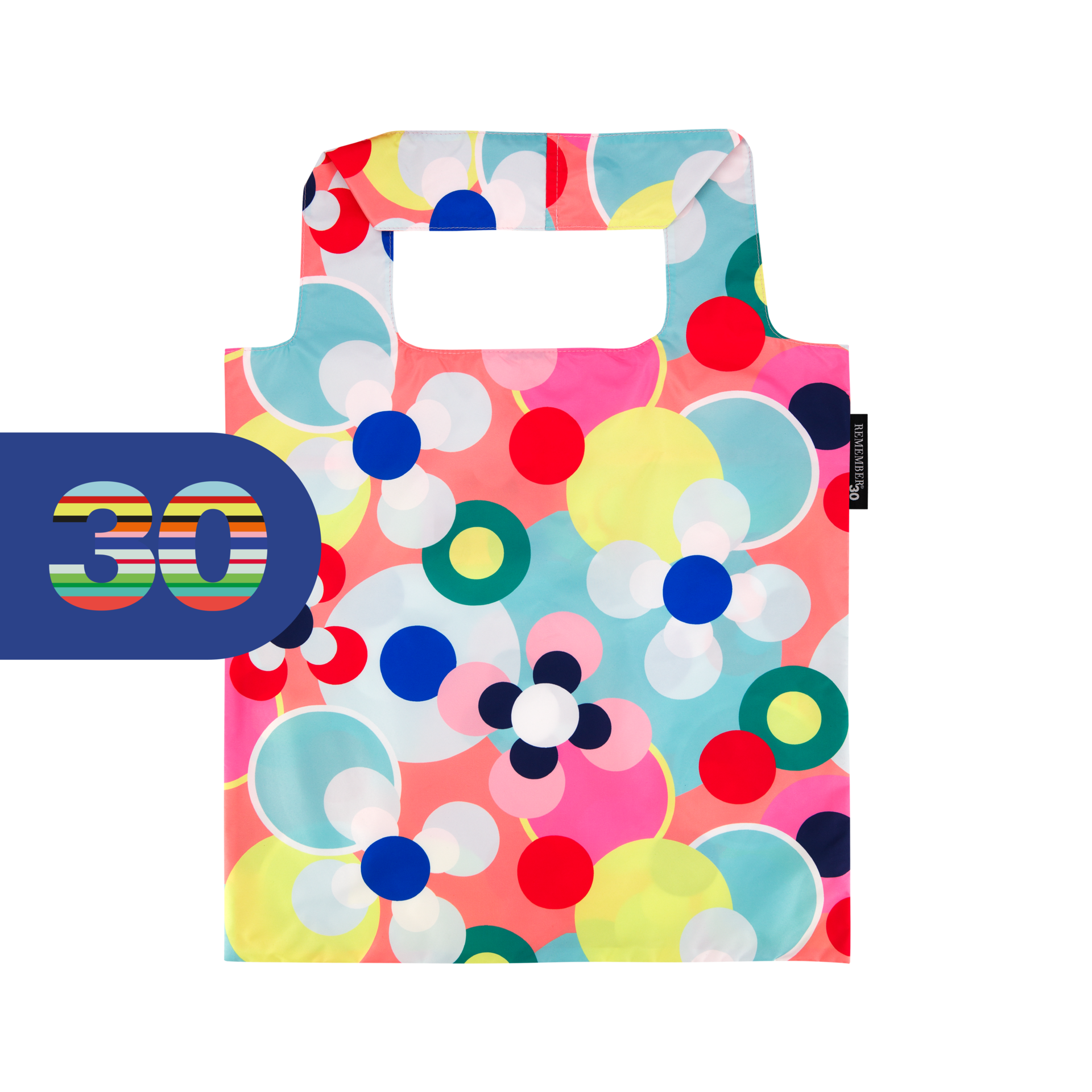 Sac de transport coloré et pliable, orné d’un motif abstrait accrocheur composé de cercles et de fleurs stylisées dans des tons de rose, rouge, bleu, jaune et turquoise sur un fond rouge corail. Doté de deux poignées et d’une étiquette «REMEMBER 30 ».