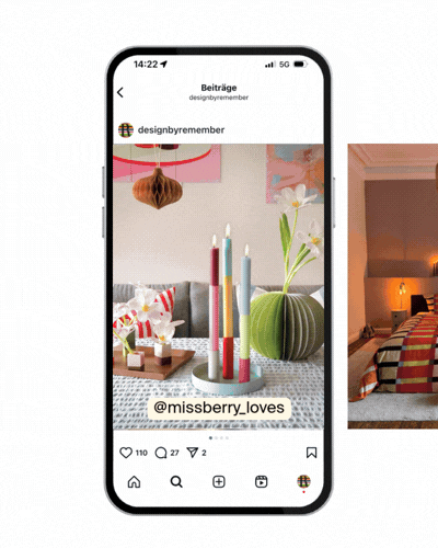 Ein Smartphone zeigt einen Instagram-Post von "designbyremember" mit farbenfrohen Kerzen, Blumen und Deko auf einem gemusterten Tisch. Unten sind Likes, Kommentare und Sharing-Icons.